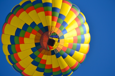 A colorful balloon floats straight overhead at the 2012 RE/MAX of Midland Hot Air Balloon festival. Photo by Mark Kawiecki.